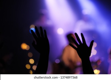 Blurred Photo Of Christian Worship God Together In Church ,raised Hand And Praise The LORD ,concert Background.