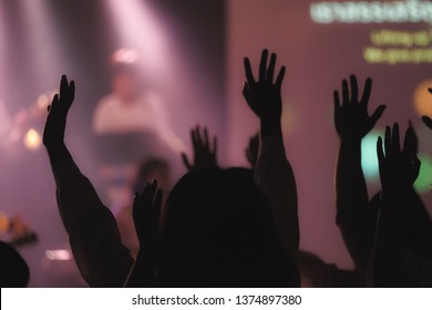 Blurred Photo Of Christian Worship God Together In Church ,raised Hand And Praise The LORD ,concert Background.