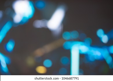 Blurred Photo Of Concert Stage Lights.Abstract Musical Background.Playing Guitar And Worship Concert Concept.Live Music Background.Music Festival.Instrument On Stage And Band.