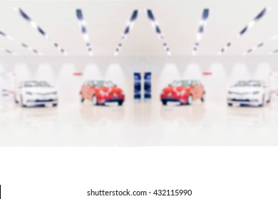 Blurred Photo De Focused New Car In  Showroom : For Background Use