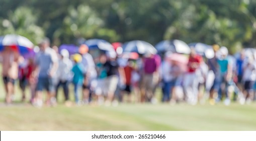 Blurred Photo Of Group Audience Moving On Green After The End In Golf Tournament.