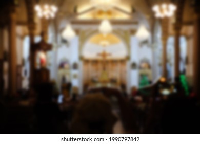 Blurred Photo Of The Inside Of A Church Sanctuary That Is Filled With People 