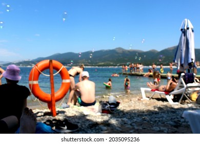 Blurred Photo People Sitting Seaside Beach Beach Hot Summer Day