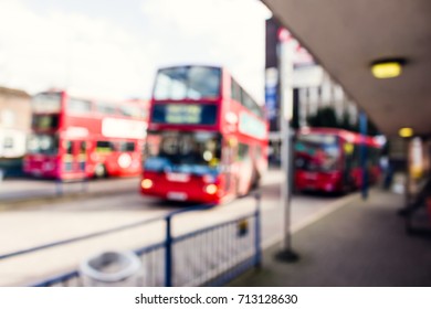 Blurred photo of red UK, London buses. - Powered by Shutterstock