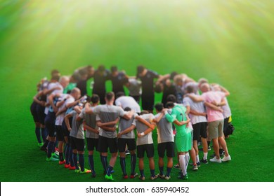 Blurred photo of  soccer players which has strategy discussion - Powered by Shutterstock