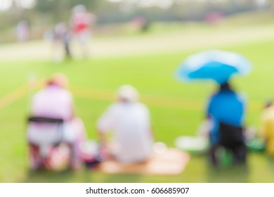 Blurred Photo Of Spectators Are Looking The Match In Golf Tournament. 