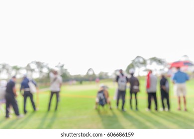 Blurred Photo Of Spectators Are Looking The Match In Golf Tournament. 