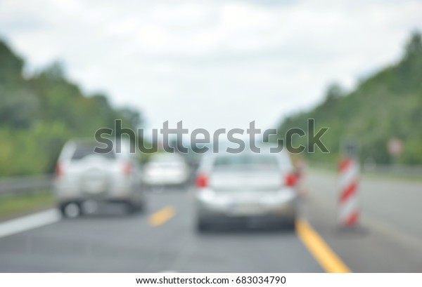 blurred picture ,cars on the\
road