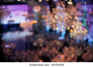 Blurred picture of crystal chandeliers hanging over the dinner tables - Shutterstock ID 639707035