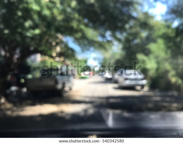 Blurred\
picture Road Soi village background in\
city