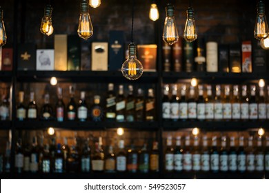 Blurred picture of vintage lamps with liquor bar.
