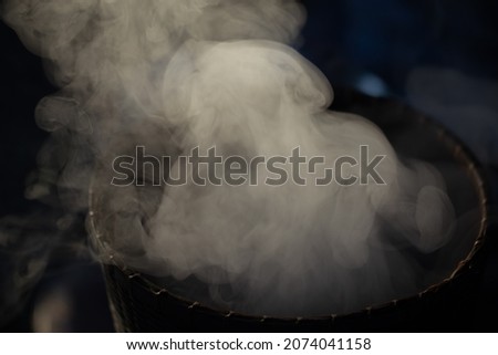 Blurred picture of white smoke from steam glutinous rice in countryside kitchen. soft picture