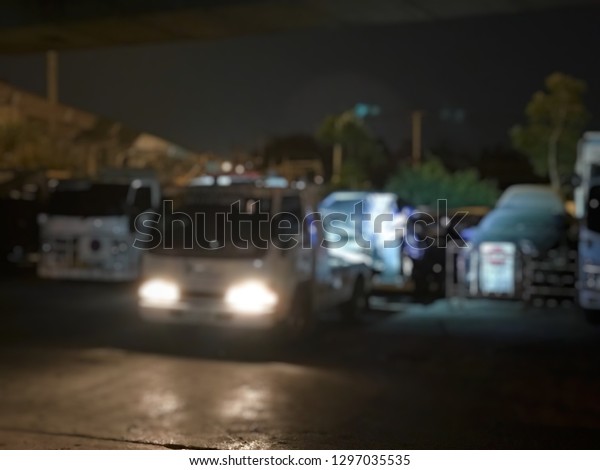 Blurred of police department tow truck are\
towing black vehicle are broken on the road to prevent the danger\
of accident duplicate and deliver to the\
garage
