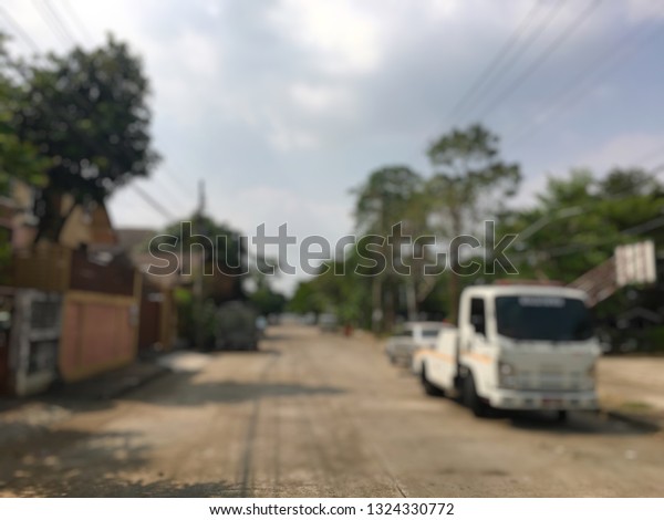 Blurred of police department tow truck are\
towing bronze vehicle are broken on the road to prevent the danger\
of accident duplicate and deliver to the\
garage