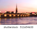 Blurred of Pont de Pierre bridge with St Michel cathedral, Bordeaux, France