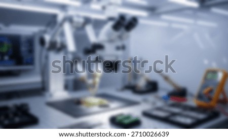 Blurred precision Microscope in hitech lab with electronics repair.