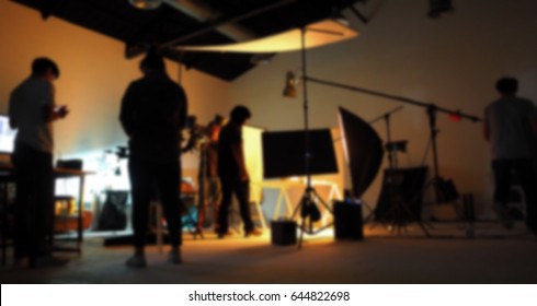 Blurred Of Production Team Shooting Some Video Movie For Tv Commercial With Studio Equipment Set.