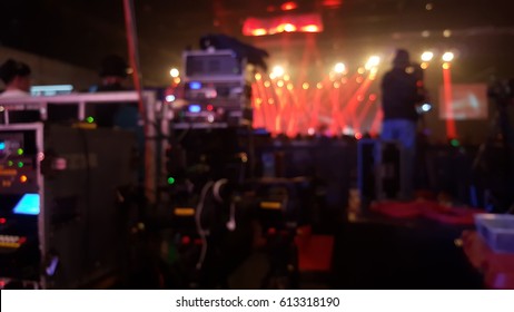 Blurred Production Team And Stage In The Hall. 