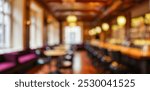 Blurred pub interior, warm ambient lighting, cozy bar atmosphere, soft focus on furnishings, inviting social space for drinks and gathering