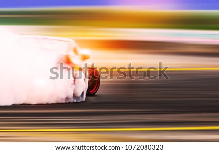 Blurred Race car drifting on speed track / Motosport