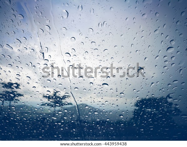 Blurred rain drop
on the car glass
background