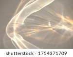 Blurred rainbow light refraction texture overlay effect for photo and mockups. Organic drop diagonal holographic flare on a white wall. Shadows for natural light effects