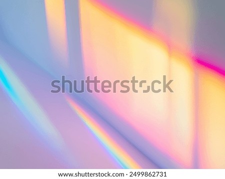 Blurred rainbow light refraction texture overlay effect for photo and mockups. Organic drop diagonal holographic flare on a white wall. Shadows for natural light effects