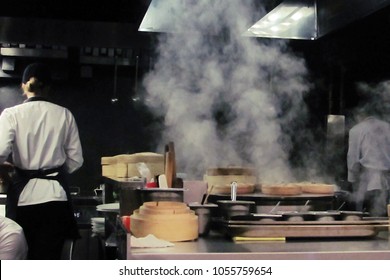 Blurred Restaurant Chef: Chef Cooking In The Open Kitchen, Customer Can See They Cooking At Food Counter