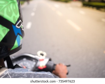 Blurred Riding Motorbike On The City Road With Helmet For Safety. Point Of View Concept.