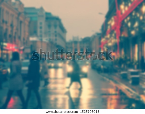 blurred road in big city, evening city, people,\
shops in lights.