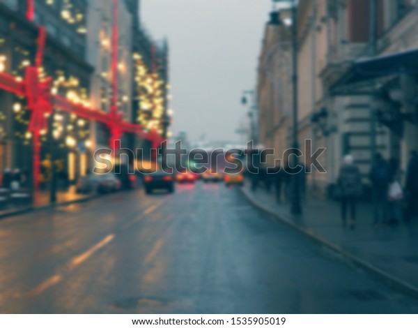 blurred road in big city, evening city, people,\
shops in lights.