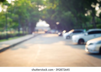 Blurred Road And Car In Park