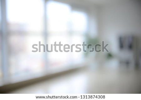 Blurred room with big window