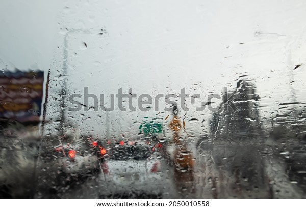 Blurred, Rush hour after work, Cars\
stuck and traffic jam in the rain Bangkok\
Thailand