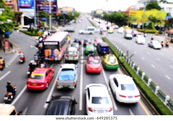 blurred Rush hour with cars and generic\
vehicles . Traffic jam in Bangkok Thailand.\
