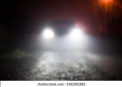 Blurred Scene Of Car Light At Foggy Night