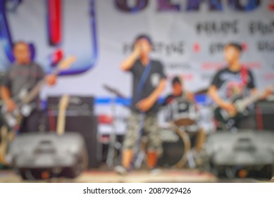 Blurred Scene Of Concert Performance With Stage In Daylight