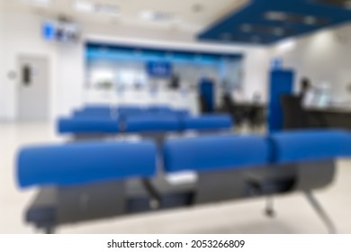 Blurred Scene Of Modern Bank With Blue Seat, Counter Cashier Background