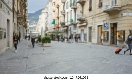 Blurred scene of people walking along a picturesque street in la spezia, italy, featuring a woman with luggage among charming historic buildings in a town setting. - Powered by Shutterstock