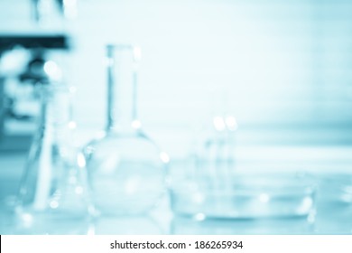 Blurred Science Background, Test Tubes And Microscope With Copy-space