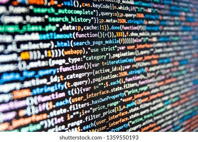 Blurred screen with selective focus. Programmer working on computer screen. Web abstract programming and created virus on laptop screen. Programming Javascript on laptop computer screen 