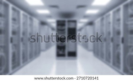 Blurred Server Room Data Storage with Cybersecurity, and Network Infrastructure.