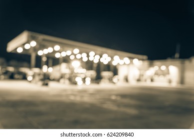 Blurred Several Large Over Road Semi-trucks At Fueling Station Truck Stop, Ozark, Arkansas. Defocused Gas Station, Convenience Store. Transportation, Industrial Background Bokeh Light. Vintage Tone.