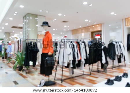 Blurred showcases fashion boutique Clothing store in a modern shopping mall. Cloth and acessorie modern shop blur background.