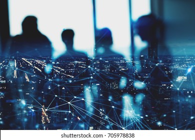Blurred silhouette of businessperson in office with network effect. concept of partnership and teamwork - Shutterstock ID 705978838