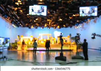 Blurred Silhouette Cameraman With  Staff In TV Studio Station