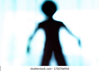 Blurred Silhouette Of Human Body Look Like Alien.