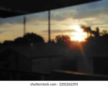 Blurred Silhouette Photo Of Residential Neighborhood Under The Evening Sky