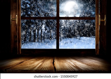 Blurred snowy winter landscape outside the kitchen window with table top for products and decorations or text. - Powered by Shutterstock