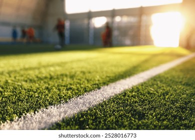 Blurred Soccer Field at School. Young Soccer Players Training on Pitch. Soccer Stadium Grass Background - Powered by Shutterstock